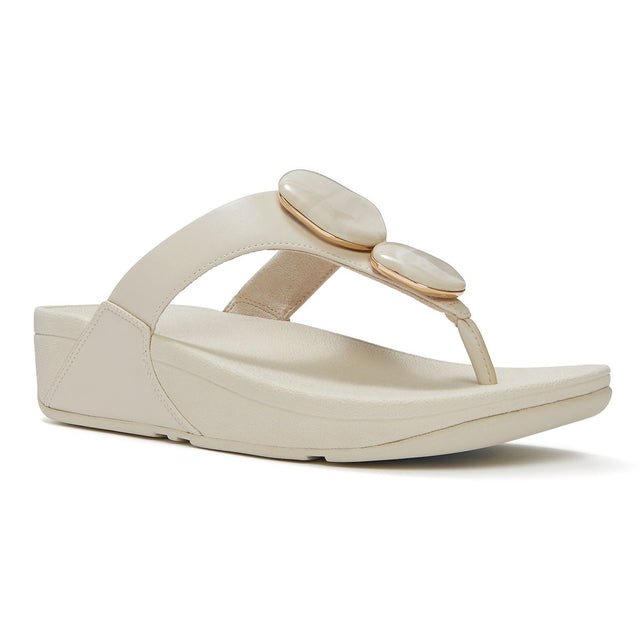 Women's beige leather thong sandal featuring two marbled stones with gold rims on the strap and a wedge sole. Style #A4L-A99