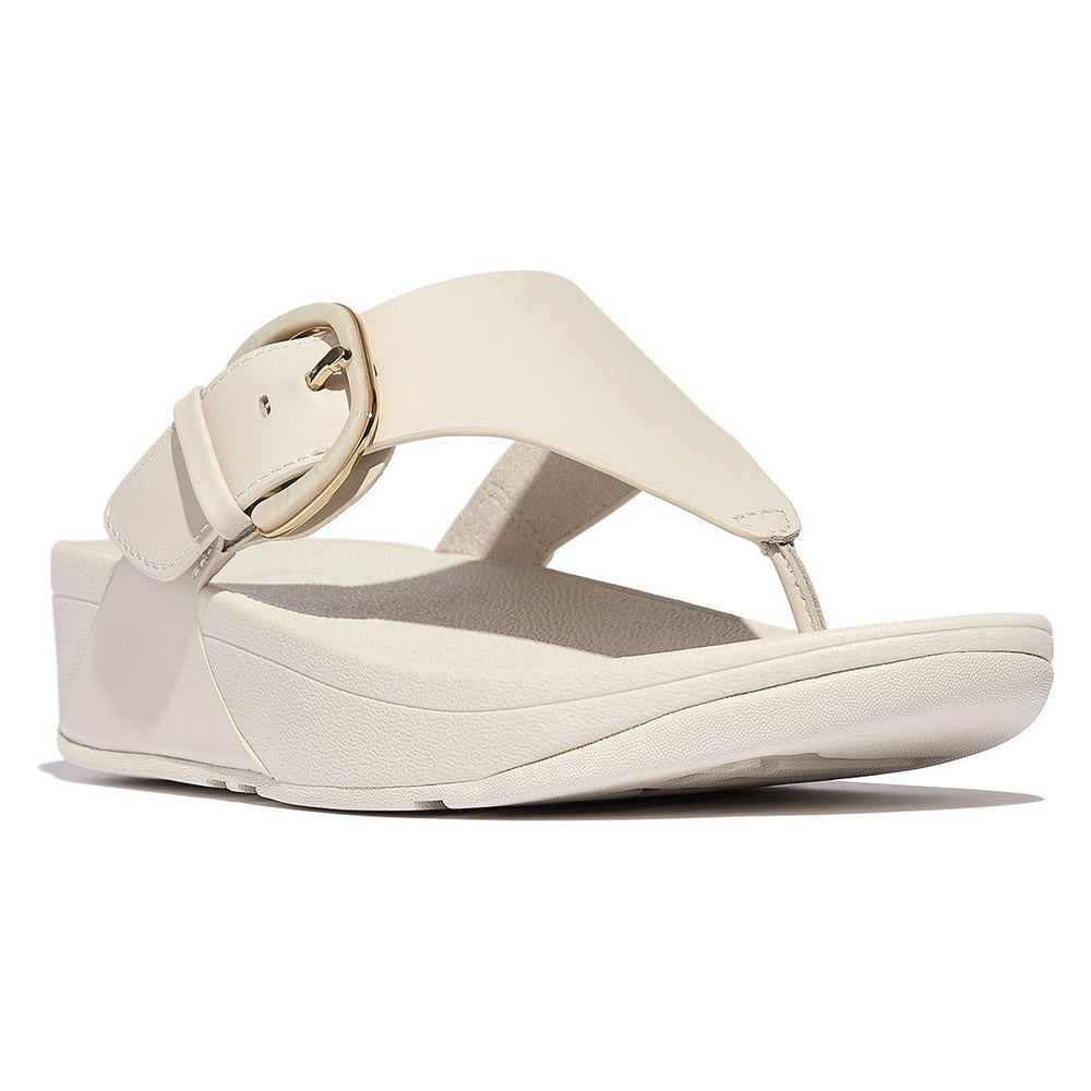 Beige leather thong sandal with a large adjustable covered buckle and ergonomic Microwobbleboard sole. Style #HG9-A20