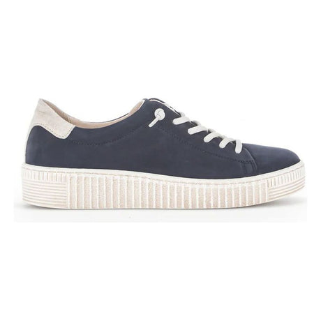 A navy blue suede women’s lace-up sneaker with white laces, a white heel accent, and a thick white textured sole. Style #53-331-16