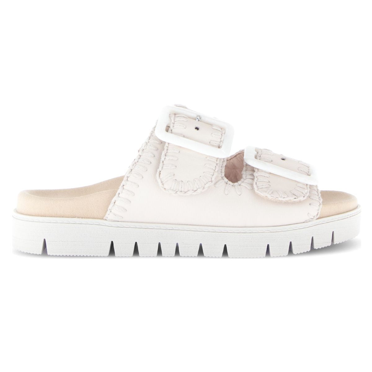 Women’s off-white leather slide sandal with two large white buckles, whipstitch detailing, and a thick white sole. Style #741.22