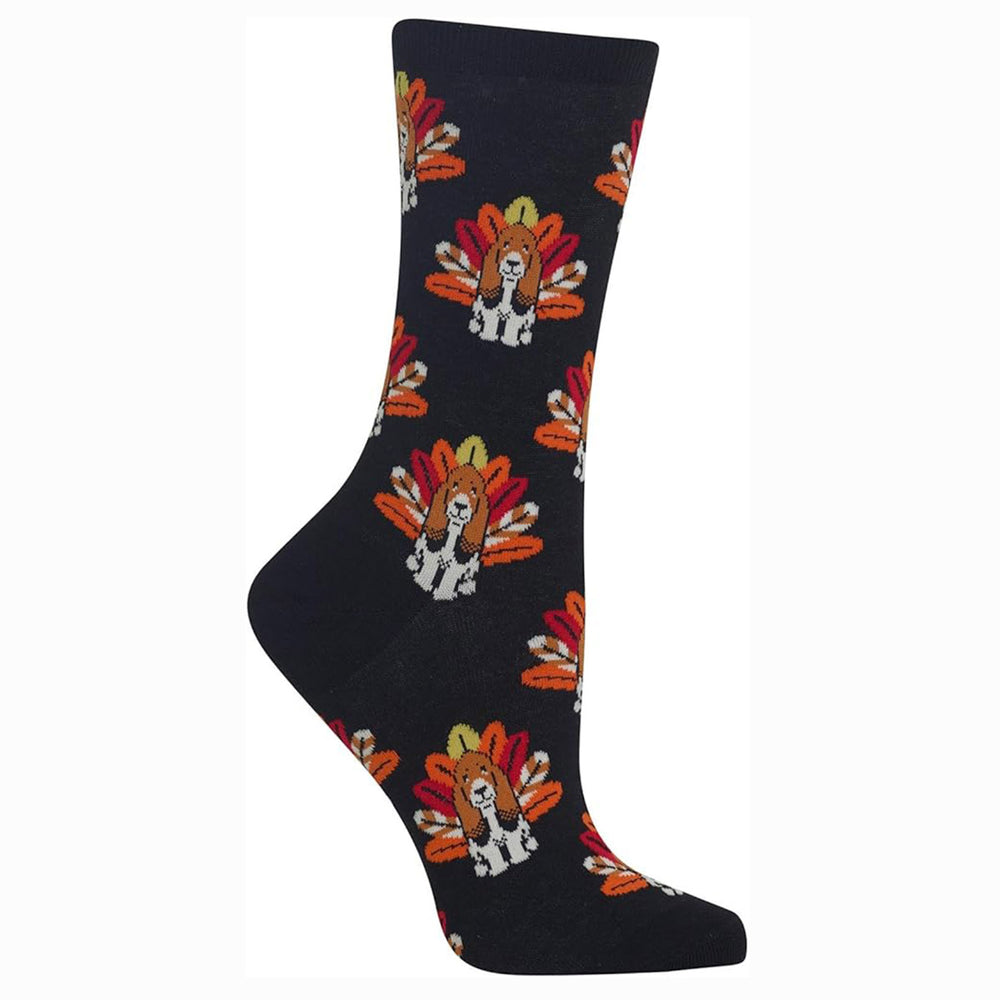 Black Hot Sox brand sock with a pattern of white dogs resembling basset hounds, each with an orange and brown turkey fan tail. HO002518.