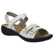 Women’s white leather sandal with three adjustable straps, silver stud accents, and a black wedge sole. Style #86786-000