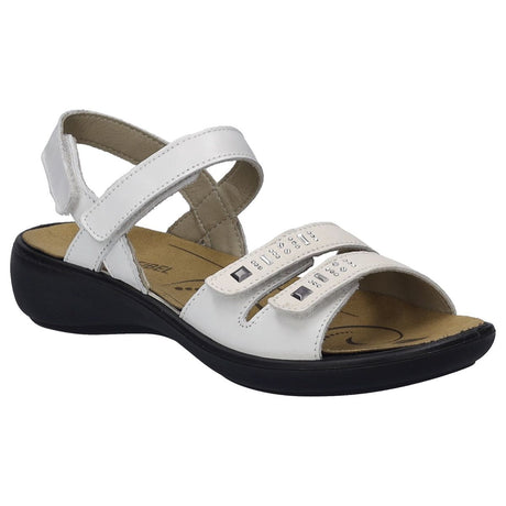 Women’s white leather sandal with three adjustable straps, silver stud accents, and a black wedge sole. Style #86786-000