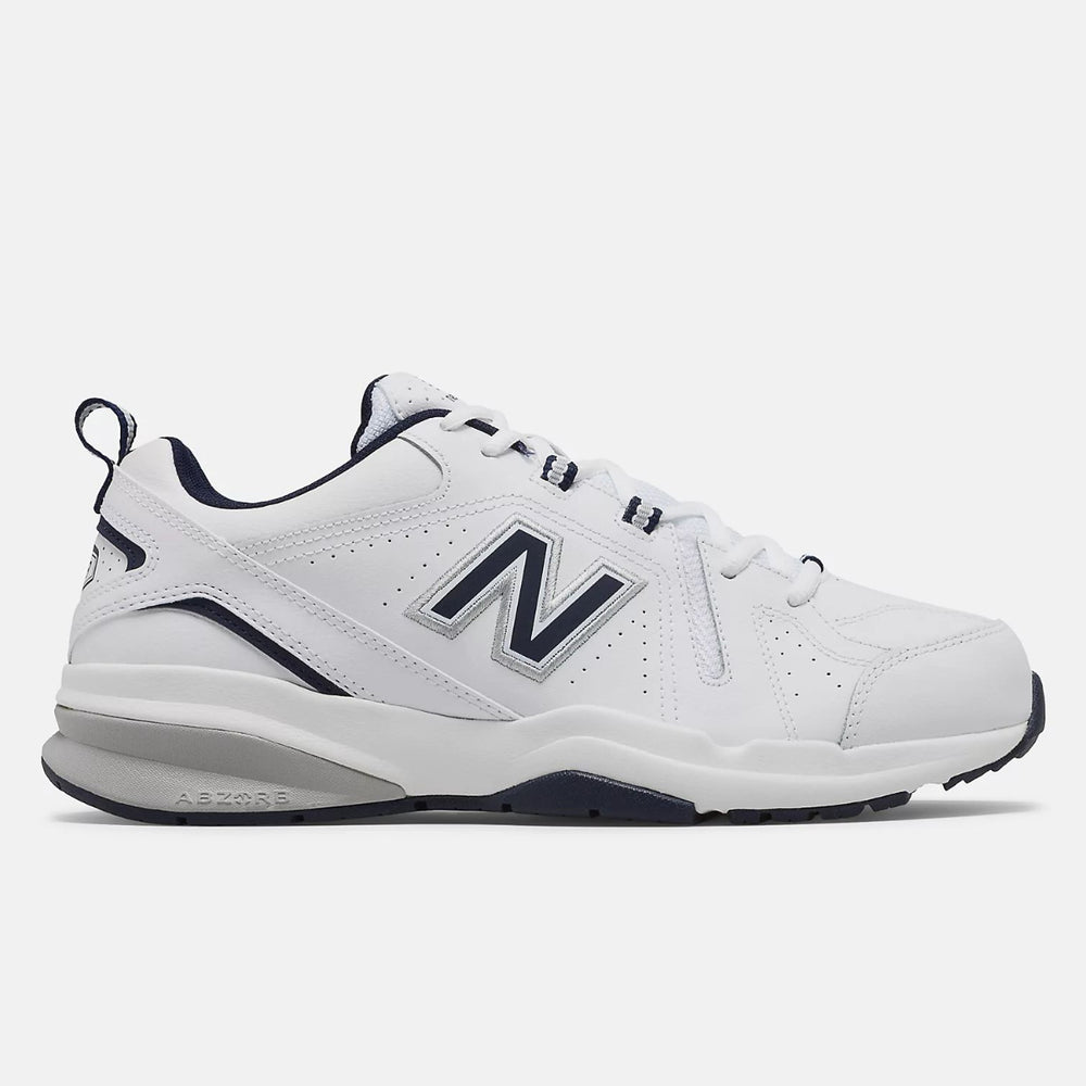 Men's New Balance MX608v5 walking shoe in white leather with navy blue collar and silver logo, featuring a visible ABZORB heel. Style #: MX608WN5