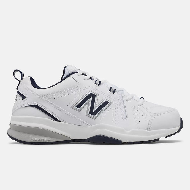 Men's New Balance MX608v5 walking shoe in white leather with navy blue collar and silver logo, featuring a visible ABZORB heel. Style #: MX608WN5