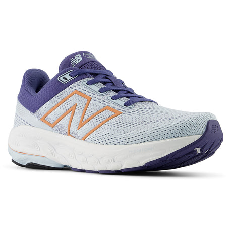 Women's New Balance Fresh Foam X 860v14 stability runner in light blue mesh with white sole, purple trim, and peach 'N' logo. Style # W86014E.