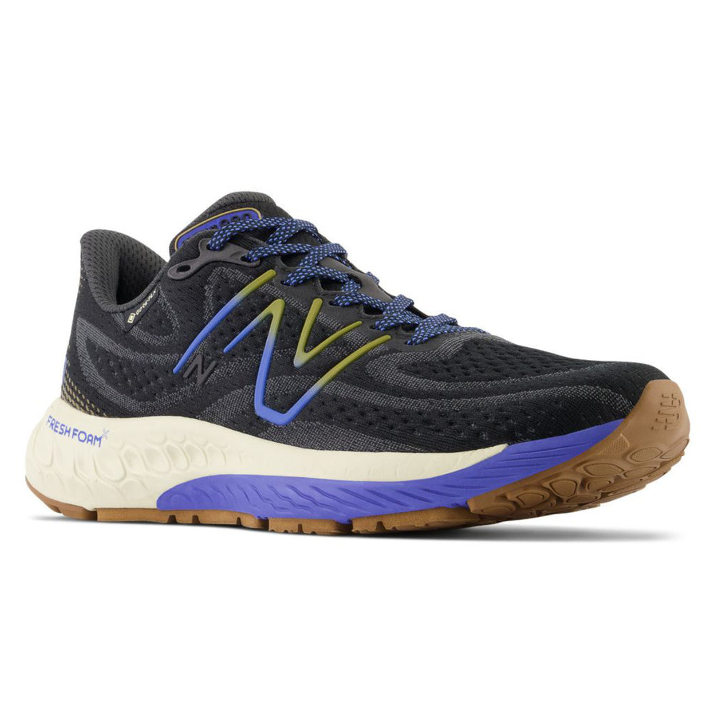 Women's New Balance Fresh Foam X 880v13 GORE-TEX running shoe in black, blue, and yellow with a rugged brown outsole. Style #: W880GP13