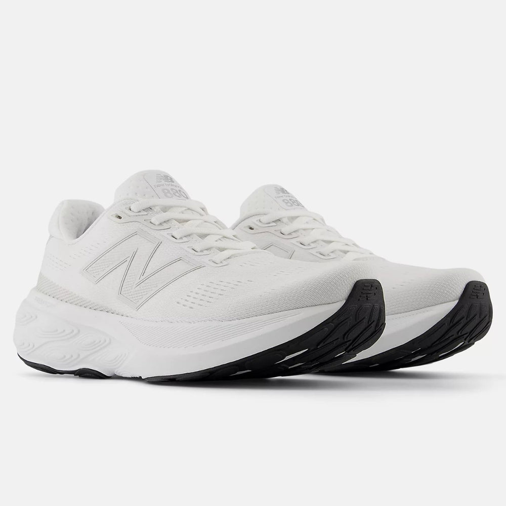 White New Balance Women's Fresh Foam X 880v15 running shoe with breathable engineered mesh upper and black rubber outsole. Style #W880W15.