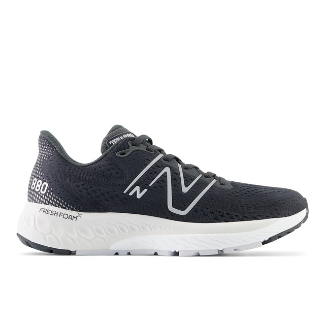 Women’s black engineered mesh running shoe with a silver logo, white midsole, and black rubber outsole. Style #W880K13.