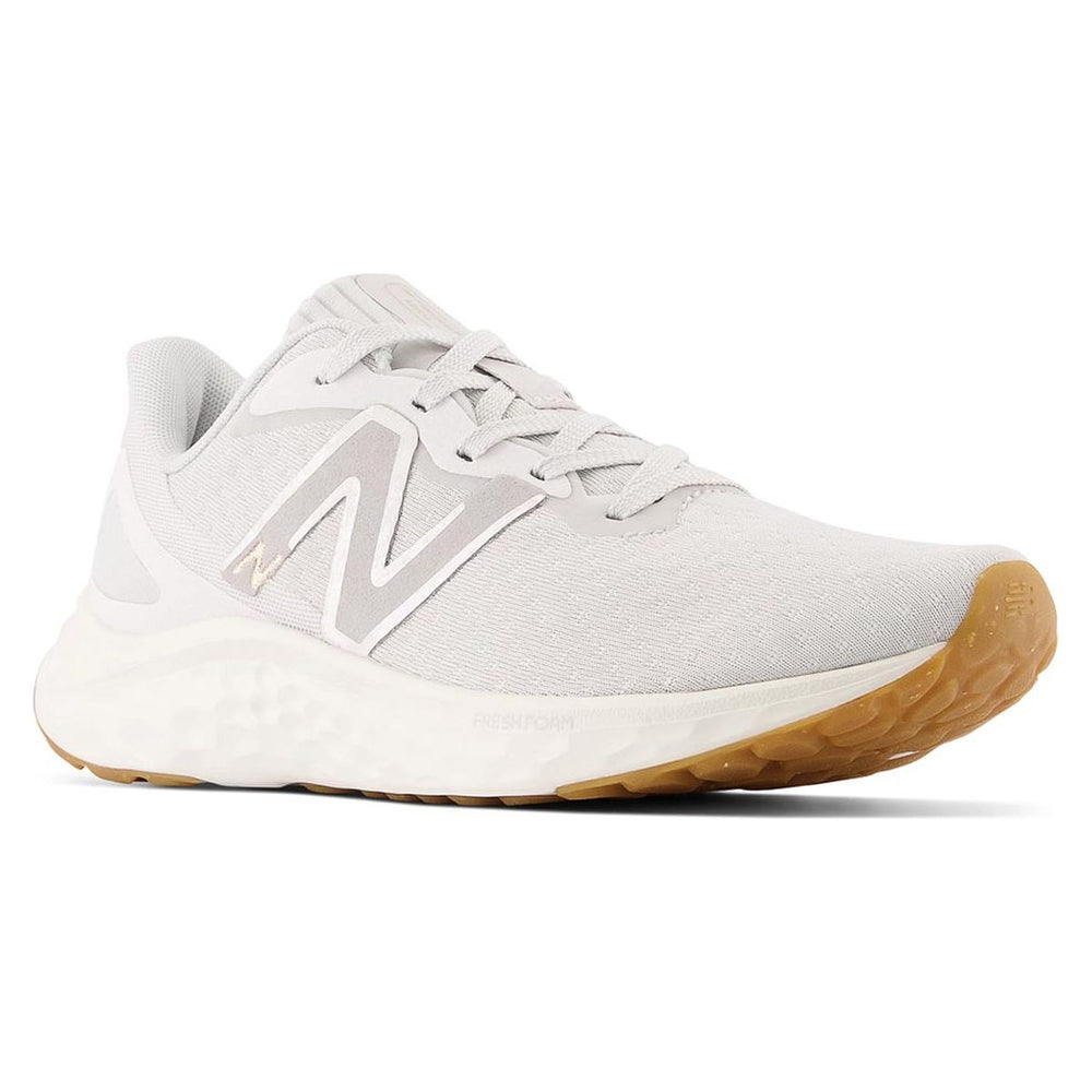 Women's white athletic sneaker with grey logo, thick white Fresh Foam midsole, and gum rubber sole. Style #WARISEG4