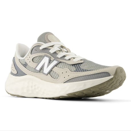 Lightweight women’s running shoe in Angora and grey with breathable mesh upper, Fresh F oam midsole, and sleek lace-up design for everyday athletic style.Style #WARISTM4