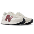 New Balance WS327JWC women’s runners in off-white suede with burgundy logo and black outsole, angled front-side view.