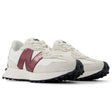 New Balance WS327JWC women’s runners in off-white suede with burgundy logo and black outsole, angled front-side view.