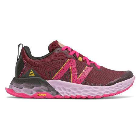 New Balance Fresh Foam Hierro v6 women's trail running shoe in maroon/pink with light pink midsole and Vibram outsole. Style #WTHIERP6.