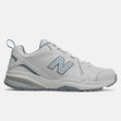 New Balance Women's WX608v5 white leather cross-trainer shoe with light blue 'N' logo and grey ABZORB midsole. Style # WX608WB5.