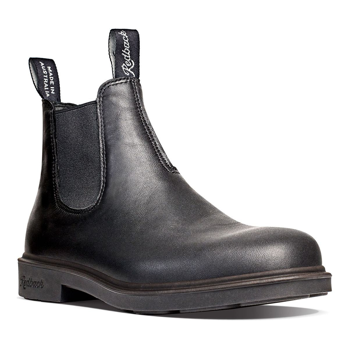 Redback Whistler pull-on Chelsea boot in black full-grain leather with elastic side panels, low-profile sole, and dual branded pull tabs. Style # RWBK.