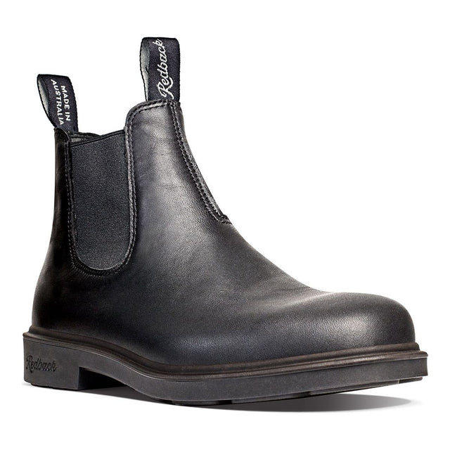 Redback Whistler pull-on Chelsea boot in black full-grain leather with elastic side panels, low-profile sole, and dual branded pull tabs. Style # RWBK.