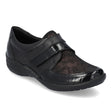 Women’s black leather slip-on shoe with floral metallic vamp, patent accents, and velcro strap. Style #R7600-03