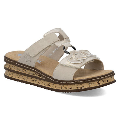 Beige mule sandal with metallic accents, interlocking strap detail, and a speckled platform sole. Style #62936-60