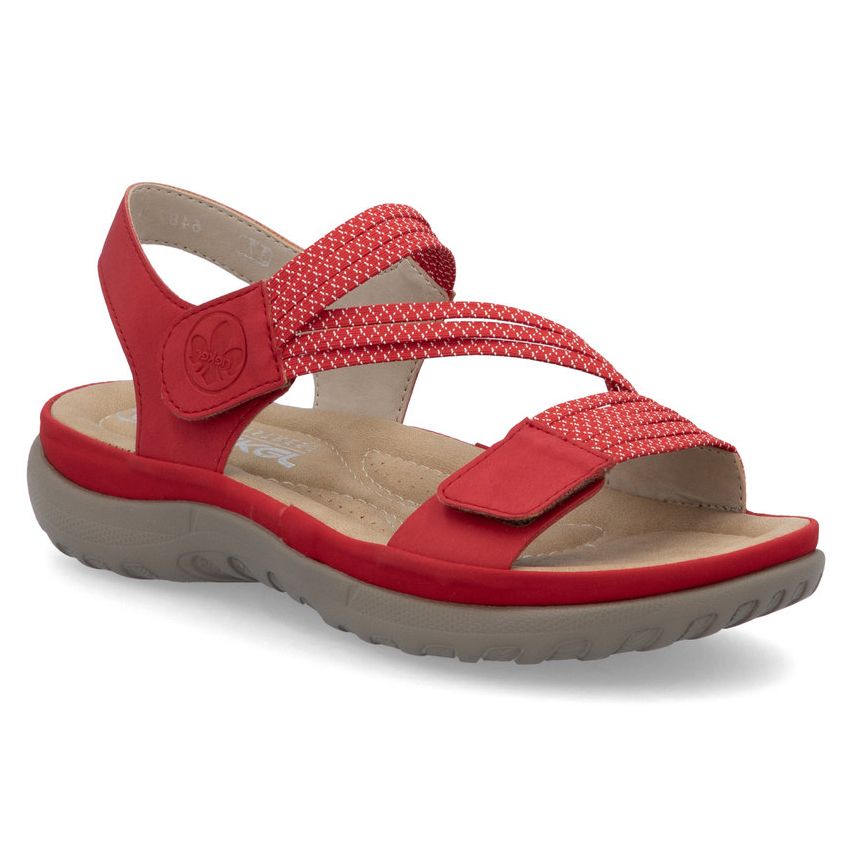 Red walking sandal with elastic cross-straps, adjustable Velcro closures, and a cushioned tan sole. Style #64870-33