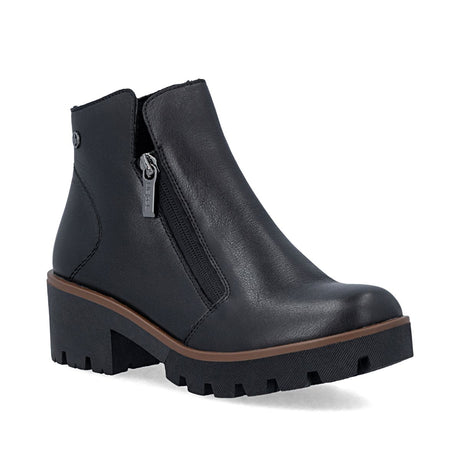 Black leather short ankle boot with dual side zippers, brown welt detail, and thick lugged sole. Style # 79254-00