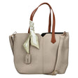 Women's beige canvas-look shoulder bag with cognac brown handles, green tied scarf accent, and shoulder strap. Style #H1045-60