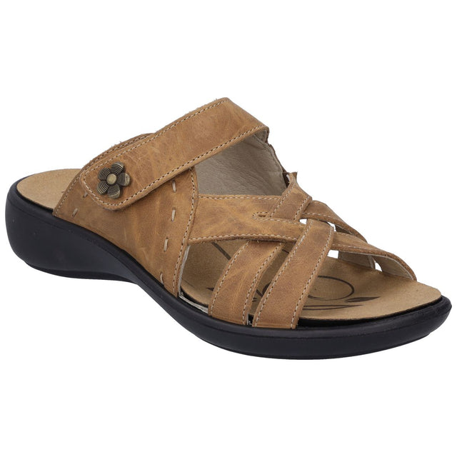 Camel leather slide sandal with criss-cross straps and a metal floral accent. Style #86799-240.