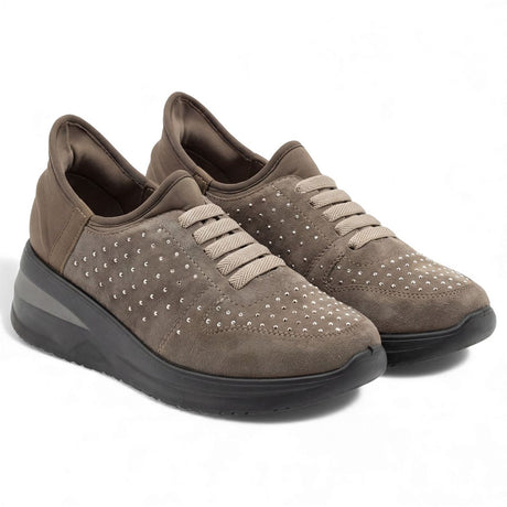 Taupe suede casual shoe with silver stud accents, elastic lace-up front, and a thick black sole. Style #F8215 TAU