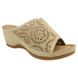 Women’s bronze slide sandal with a laser-cut pattern, glittery finish, and a comfortable wedge heel. Style # S5036.