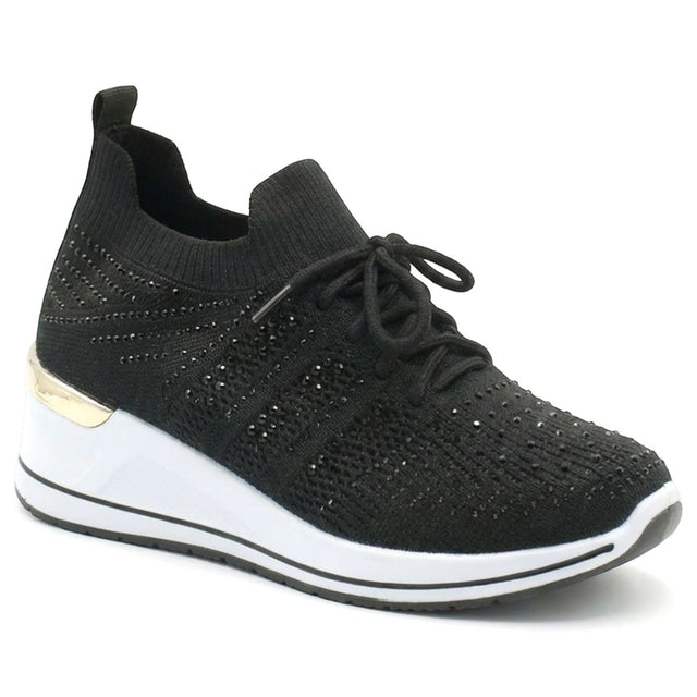 Black knit sneaker with rhinestone accents, a lace-up front, and a white wedge sole with gold detail. Style #S5479