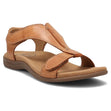 Caramel tan leather sandal with adjustable straps, a decorative T-strap, and a contoured cork footbed.