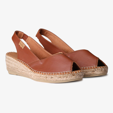 Women’s tan leather wedge espadrille with peep toe, jute-wrapped platform, and elastic slingback strap for an easy, stylish summer fit.