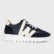 Wonders A2476 women's navy blue racer sneaker with a cream-colored W-shaped design on the side and a chunky white sole