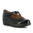 Women's black patent leather wedge Mary Jane shoe with a thick lug sole and hook-and-loop strap. Style # C33326.